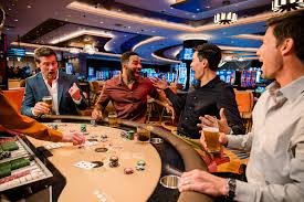 buktiqq mobile app showing Liga 1 sportsbook markets and live casino tables